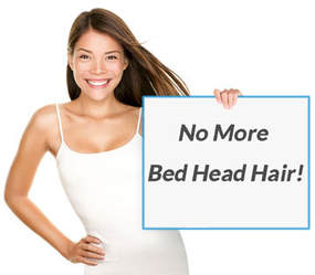 woman holding sign with text no more bed head hair